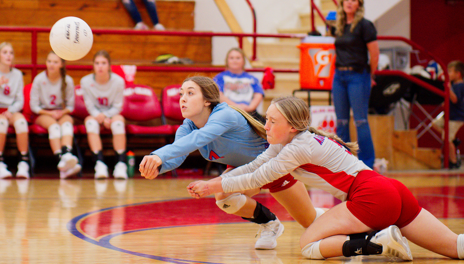 Kamrin Wright and Alyssa Murdock dig out a shot for the Lady Panthers in last week’s victory over PTAA Fate.